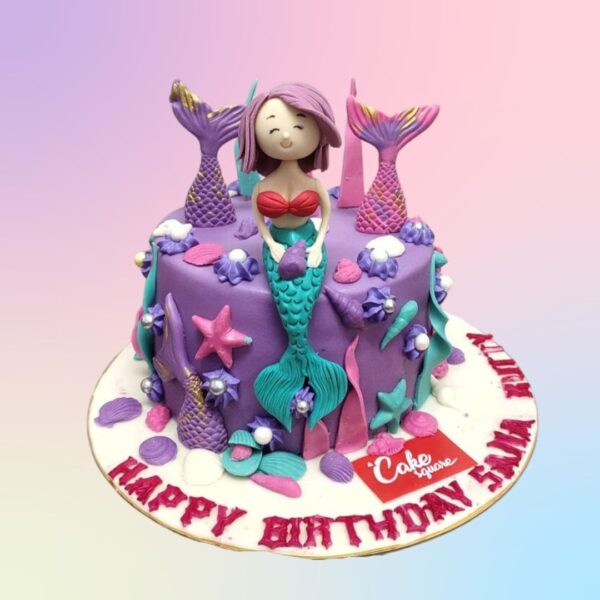 Adorable Mermaid Theme 1 Kg Birthday Cake Single-tier pastel blue cake with mermaid tail, seashells, and coral decorations