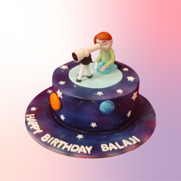 Amazing Astronaut Theme Kids Birthday Cake 1 Kg. A round cake designed to look like the moon's surface, complete with craters and a grey-white color scheme. A fondant astronaut figurine stands on top, planting a "Happy Birthday" flag. The cake is surrounded by edible stars and planets.