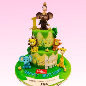 Majestic Amazing Elephant Kids First Birthday Cake 5 Kg with lifelike gray fondant, adorable eyes, and a colorful "1" banner draped over its back, surrounded by fondant leaves and flowers.