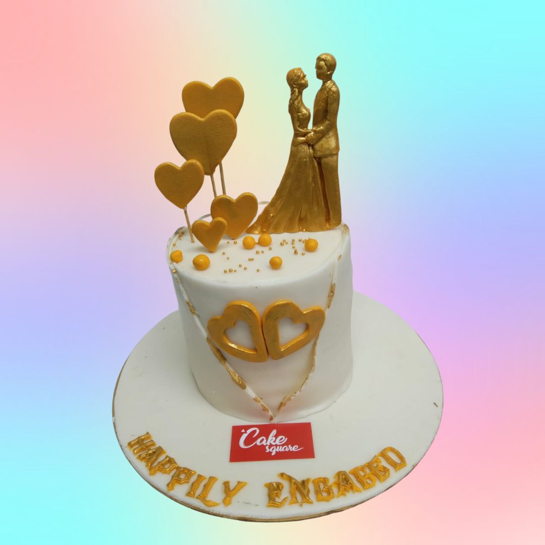 Amazing Gold Engagement Theme Cake 1 Kg. A luxurious 1 kg engagement cake with a gold-themed design, featuring elegant accents that radiate sophistication and celebration.