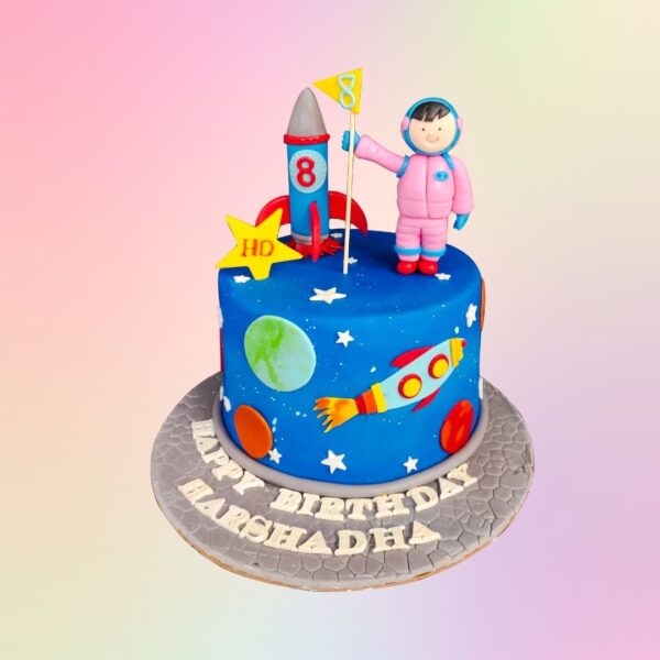 A Amazing Rocket Scientist Theme Birthday Cake 1 kg, Featuring a rocket, planets, and stars, perfect for young aspiring scientists and space enthusiasts.