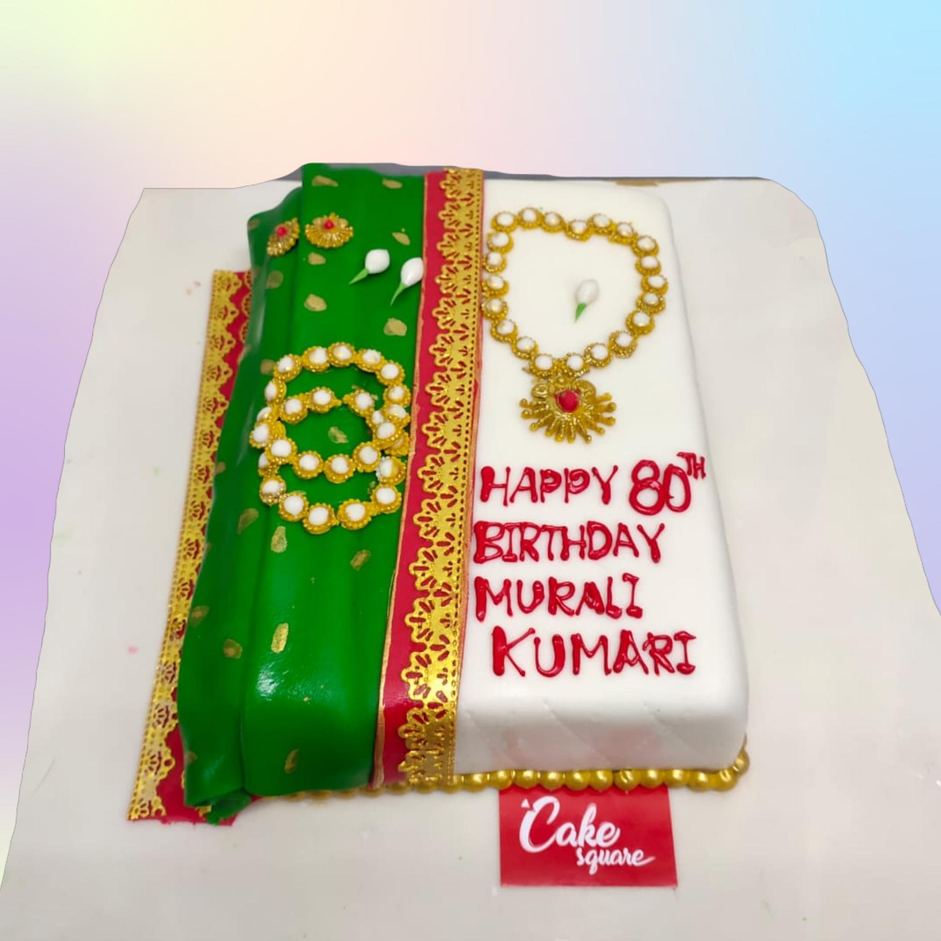 Amazing Saree Birthday Cake 1 Kg - cake shaped like a folded saree with intricate design patterns and blouse piece decoration