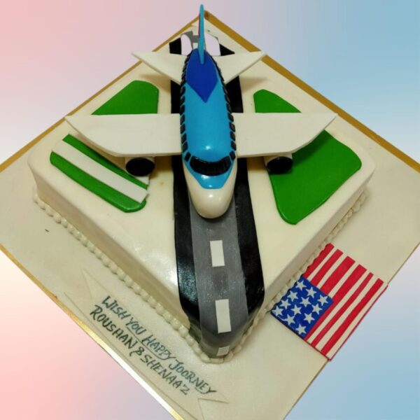 Awesome Aeroplane Theme Cake 2 Kg shaped like a plane, with detailed fondant work, clouds, and a "Happy Birthday" banner trailing behind. Perfect for aviation enthusiasts of all ages.