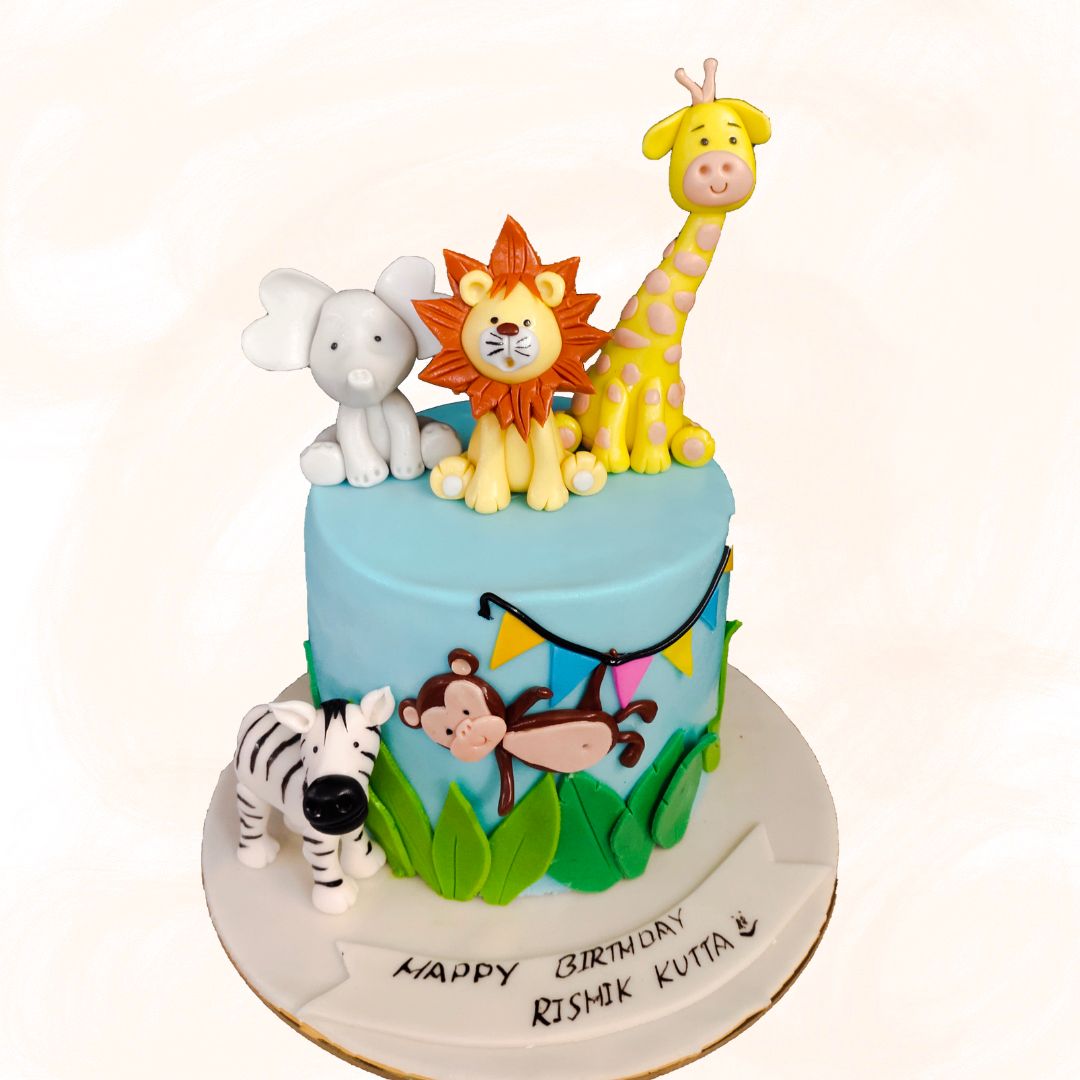 Awesome Animals 2nd Birthday Cake by Cake. Adorable 2nd birthday cake featuring playful fondant animals and festive decorations.