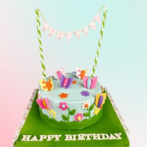 Awesome Busy Butterfly Girls Birthday Cake 1 Kg. Lively 1 Kg girls' birthday cake with playful butterflies and vibrant floral design.