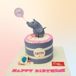 Adorable Awesome Elephant Kids Birthday Cake 1 Kg topped with a smiling cartoon elephant, surrounded by colorful balloons and stars, all crafted from fondant on a pastel background.