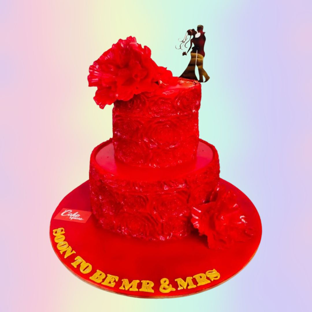 Awesome Red Engagement Cake 4 Kg with gold accents, intricate piping, and a romantic "Engaged" topper, perfect for bold couples.