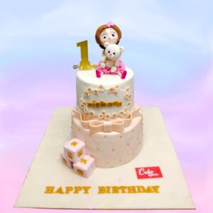 Beautiful Girls First Birthday Cake 3 Kg, Elegant pink and white tiered cake adorned with delicate flowers, butterflies, and a golden "1" topper, perfect for a baby girl's first birthday celebration.