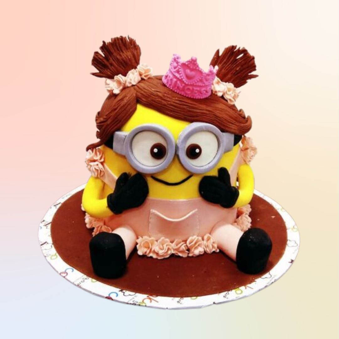 Charming Beautiful Minion Theme Girls Birthday Cake 3 Kg with purple tutu, long lashes, and tiara, surrounded by fondant unicorns and rainbows on a pastel base.