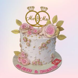 Best Elegant Engagement Cake 2 Kg with textured buttercream, gold leaf accents, and fresh flowers, perfect for intimate celebrations.