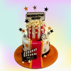 Best Movies and Popcorn Theme Birthday Cake 4 Kg - large cake shaped like a popcorn bucket with film reel decorations and edible popcorn pieces