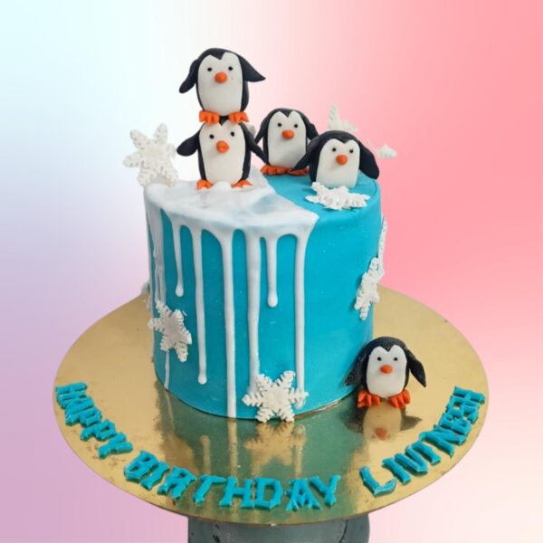 Best Sleek Penguin 5th Birthday Cake 1 Kg - round cake with cute penguin design and number 5 decoration in cool blue and white colors