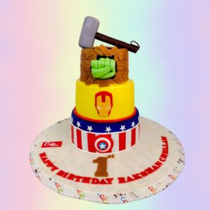 Big Avengers Theme Kids Birthday Cake 7 Kg,Massive multi-tiered Avengers-themed cake featuring iconic superhero designs, vibrant colors, and miniature figurines of popular characters, perfect for a young fan's birthday party.