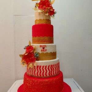 Elegant multi-tiered big wedding cakes with white fondant, intricate lace patterns, and cascading sugar flowers, created by Cake Square Chennai.