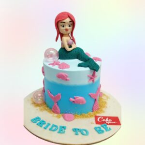 A creatively designed bachelor party cake featuring a bikini-clad figure, suitable for adult celebrations and private events.