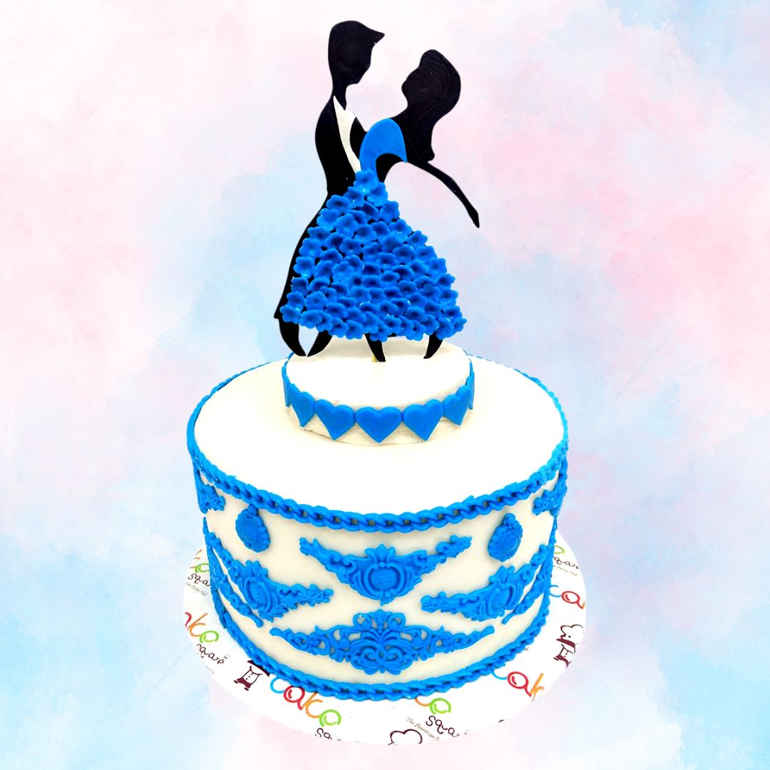 Beautiful cake jewelled with blue artisitic fondant decorations with couple dancing in cake topper Blue Love 1 Kg anniversary cake by Cake Square.