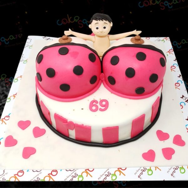 A Bra Off Bachelor Party Theme Cake, showcasing a playful and cheeky design, elegantly displayed on a decorated table, ready to enhance the bachelor celebration with fun and excitement.