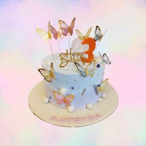 "Bright Butterfly Birthday 1 kg Cake. Colorful 1kg butterfly-themed birthday cake with floral decorations"