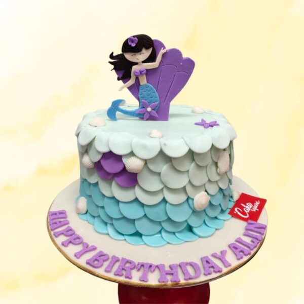 Charming Mermaid Birthday Cake For Girls 2 Kg Teal and purple cake with mermaid scales, seashells, and starfish decorations