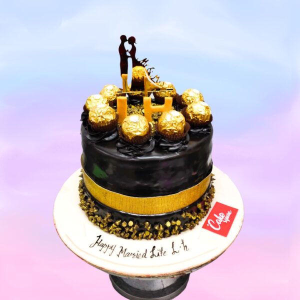 Chocolate cake topped with acute topper and ferraro rocher chocolates in Chocolate 1 Kg Anniversary Cake made by Cake Square team.