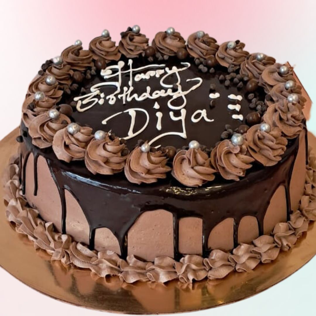 Chocolate 1 Kg Birthday Cakes filled with rich and crunchy chocolates and decorated with ganache by Cake Square team.