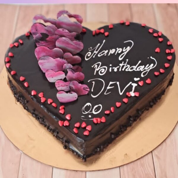 A heart shaped Chocolate cake filled with little red hearts Chocolate truffle heart shape 1 Kg birthday Cake by Cake Square Chennai.