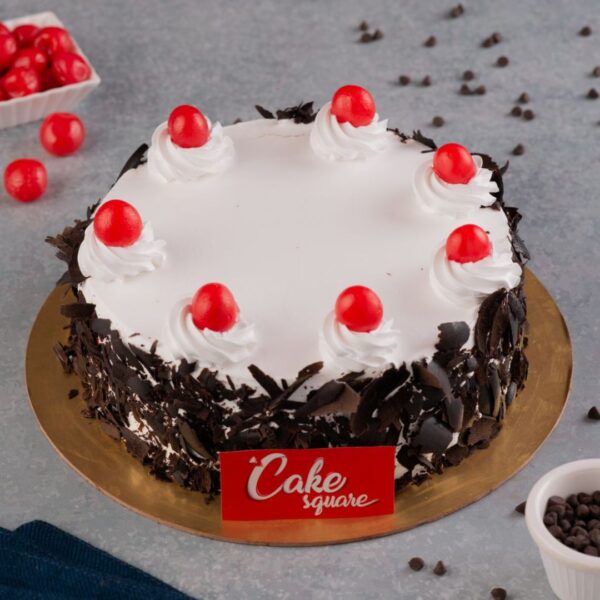 This Classic Black Forest 500 gms Birthday Cake topped wth cherries and cream and chocolate makes for a delicious treat for your birthday party.