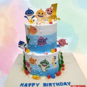 Creamy Baby Shark Birthday Cake 5 Kg. Adorable 5 kg Baby Shark birthday cake with blue ocean frosting and cute shark figures