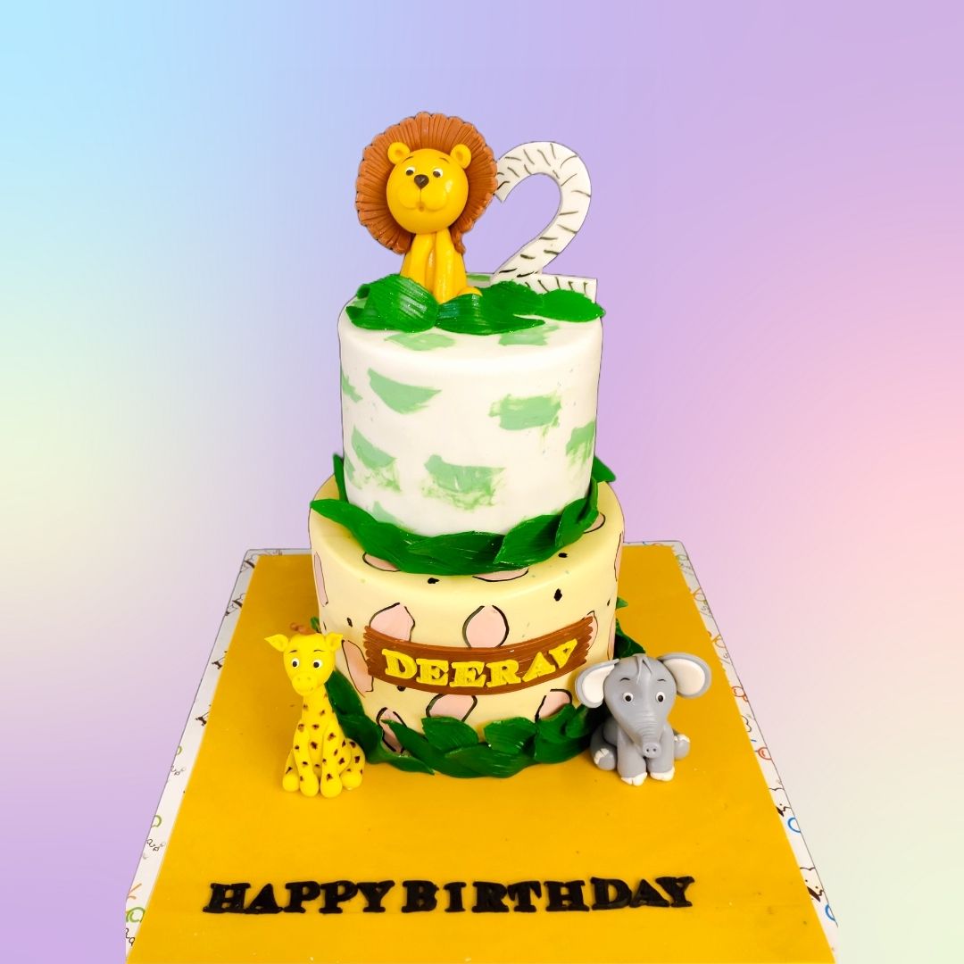 A charming 3 kg Cute Animals-themed first birthday cake, featuring an array of fondant jungle animals, perfect for a baby’s first celebration.