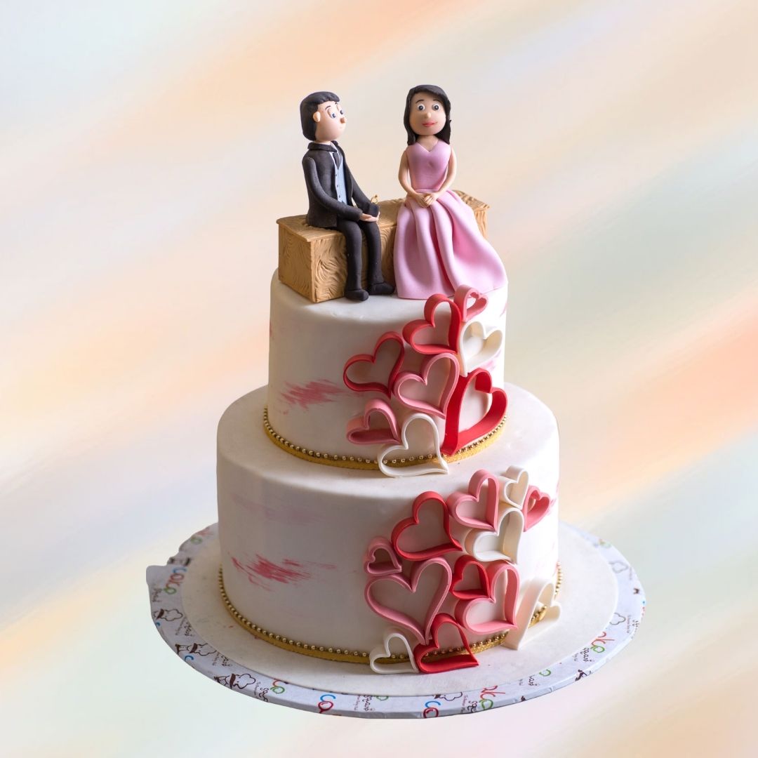 Charming Cute Couple 5 kg Wedding Cake featuring delicate fondant figurines of a bride and groom, surrounded by intricate floral designs, from Cake Square Chennai.