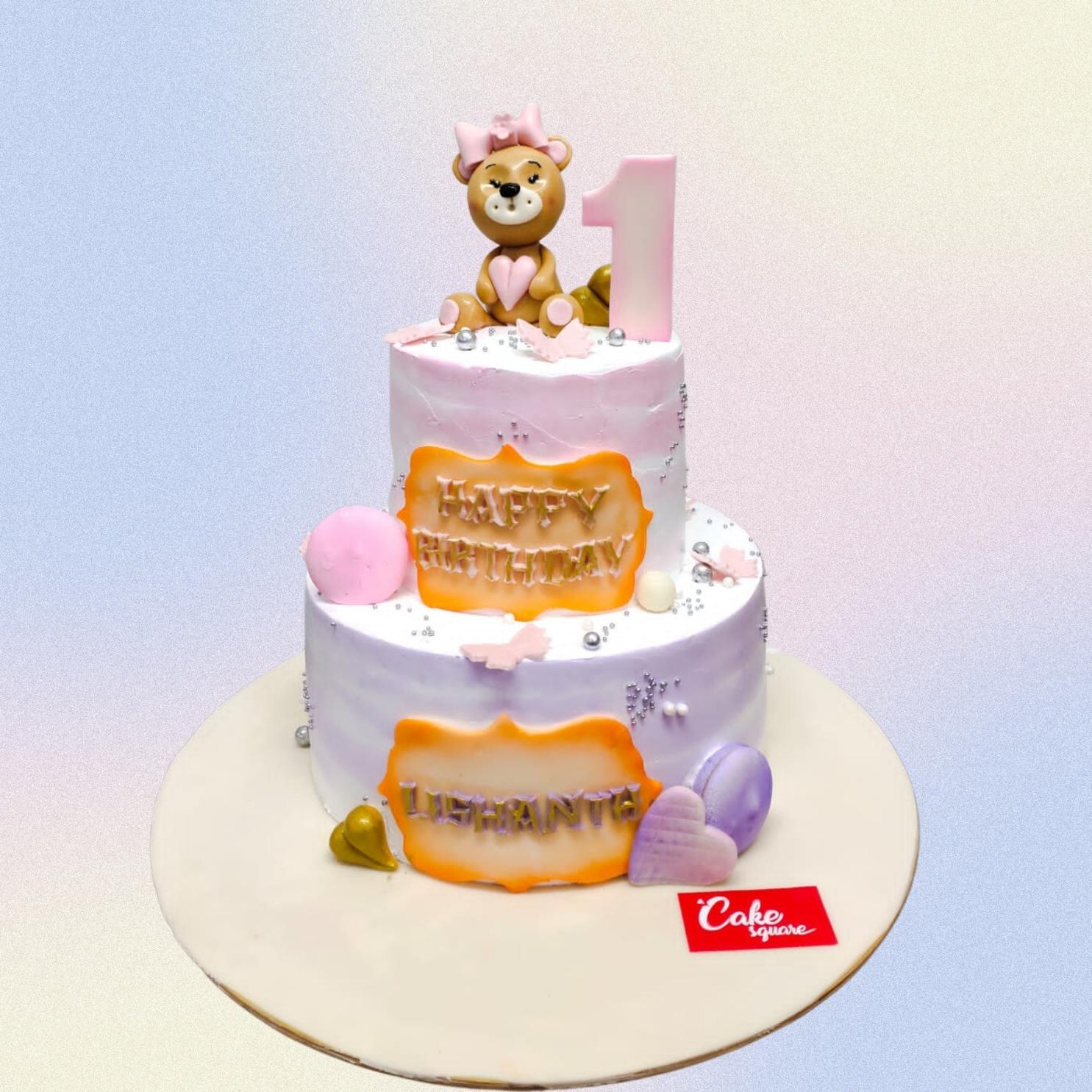 Cute Creamy Teddy No Fondant First Birthday Cake 5 Kg Four-tier cream-colored cake with piped teddy bear, balloons, and "1" decoration