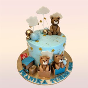 A Cute Teddy Theme First Birthday Cake 1kg, Featuring an adorable teddy bear design and soft colors, perfect for a baby’s first birthday celebration.