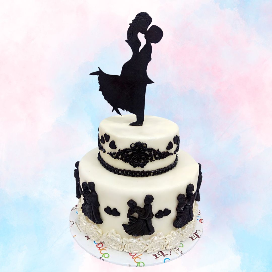 A black and white beauty, decorated with a dancing couple on a mini two tier Dancing in Love 3 Kg Anniversary Cake by Cake Square.