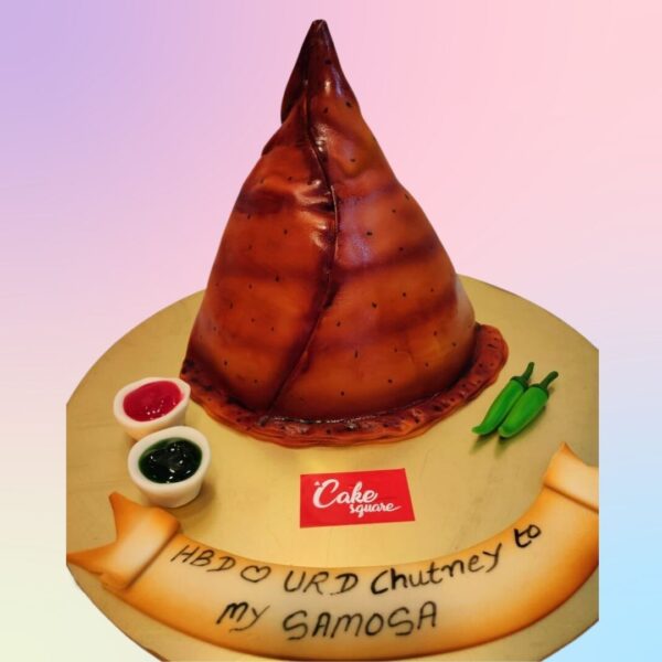 Unique Delicious Samosa Birthday Cake 1 Kg shaped like a giant samosa with realistic pastry texture and spicy-sweet flavor fusion