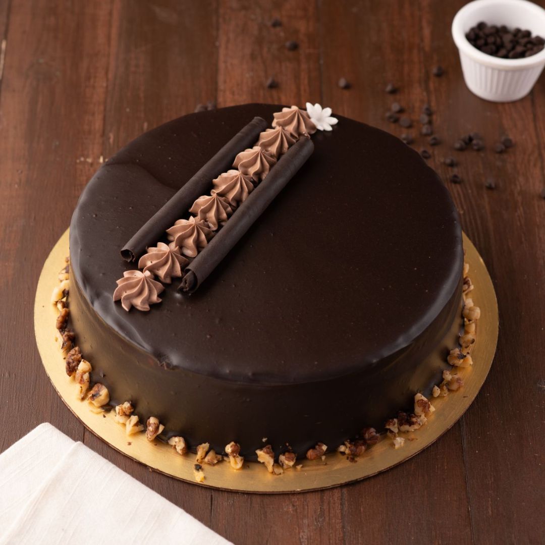 Cheese and Chocolate combination in round shape and chocolate coloured no baking cheese cake is our fancy Double Chocolate Cheese Cake 1 Kg Birthday cakes. made by cake Square Team.
