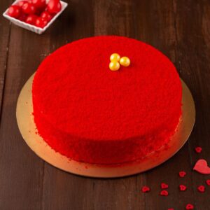 A red round cake thats dusted with red crumbles on top filled with starwberry crush in cream cheese is our Dusted Strawberry Cheese cake for Birthday 500 gms. Made by Cake Square Team.