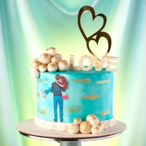 A blue cake with a couple in love and some lovely chocolate golden balls in Fancy Love 1 Kg Anniversary Cake by Cake Square Team.