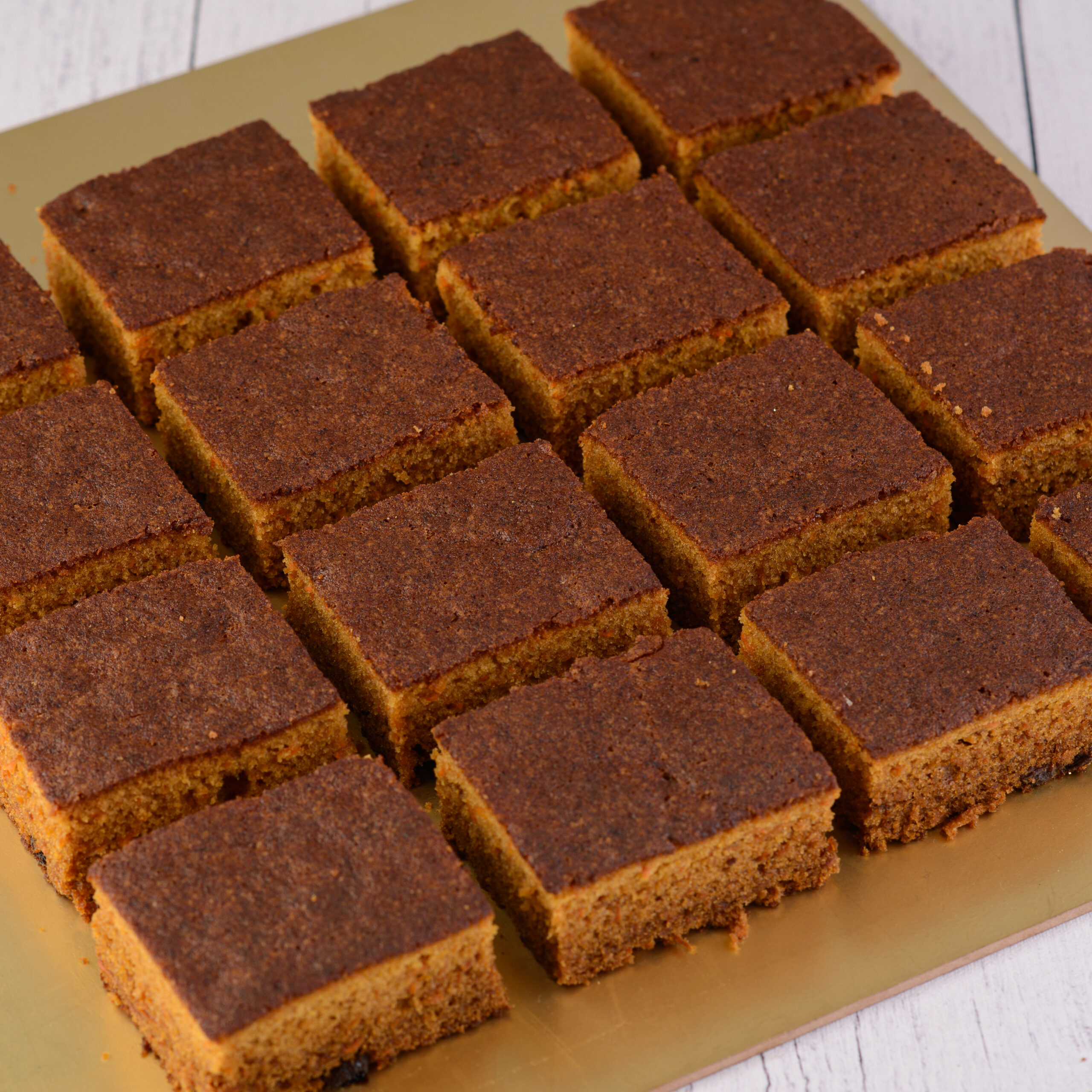 Fresh Carrot Cake Slice 80 Gms, with visible carrot shreds and nuts.