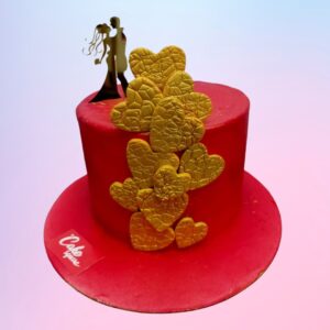 Red cake and textured hearts topping on the sides and a couple on the cake topper made by Cake Square Chennai.