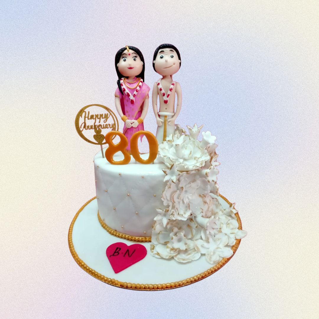 The Indian Couple 1 Kg Anniversary Cake is a cute dressed couple on top of a very original damask design made by Cake Square.