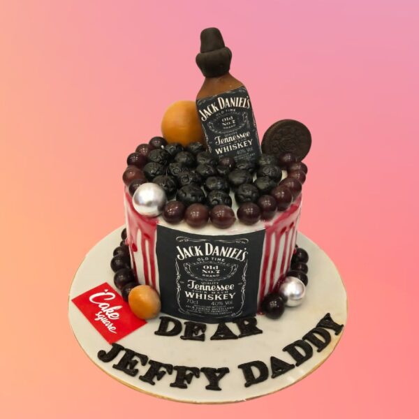 A creatively designed Jack Daniel Liquor Theme Cake featuring realistic whiskey bottle details and festive decorations, ideal for celebrating special occasions.