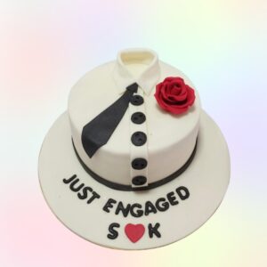 Just Engaged Cake 1 Kg. Surrounded by romantic decorations, perfect for celebrating a new beginning.