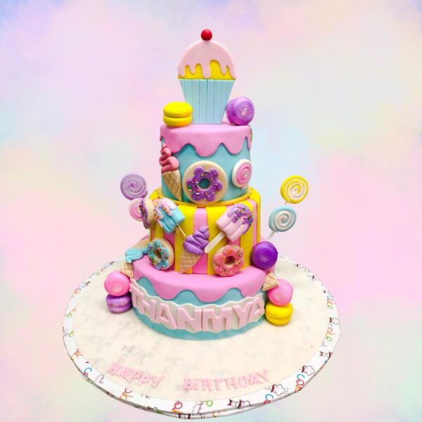 Little Miss Cupcake Girls First Birthday Cake 8 Kg - large multi-tiered cake shaped like a giant cupcake with pastel colors and sprinkles