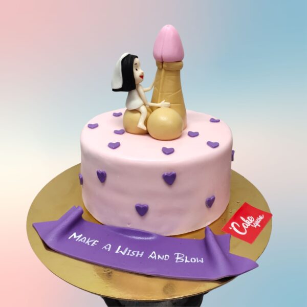 A playfully designed Make A Wish Blow Adult Cake featuring suggestive decorations and text, suitable for mature audiences and private celebrations.