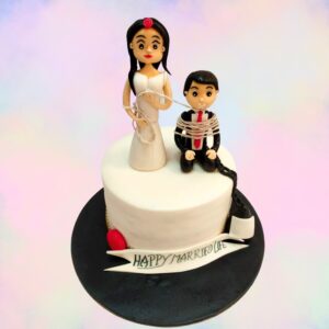 A creatively designed "Now in Control" Couple Theme Cake featuring playful decorations that celebrate love and partnership, ideal for couples' celebrations.