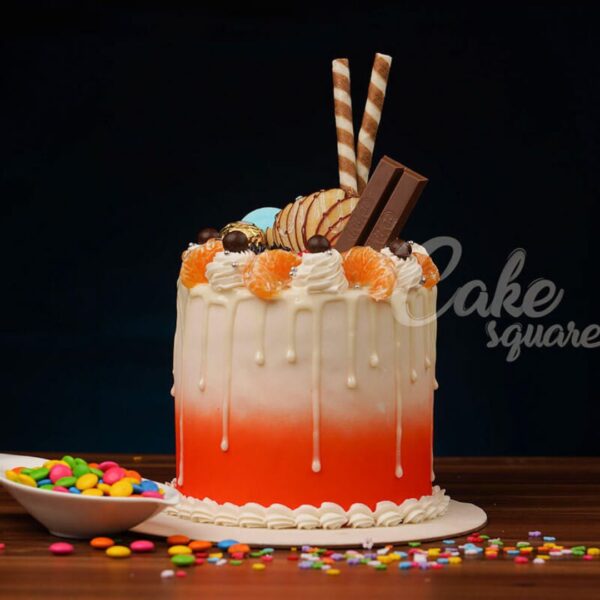 Orange Chocolate Dripping 1 Kg Birthday Cake.Tangy-sweet orange chocolate drip cake, a zesty twist for birthday celebrations