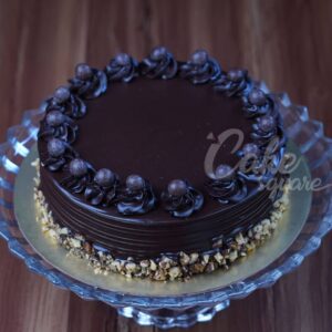 "Original Hazelnut Chocolate Cake 1 Kg Birthday Cakes. Hazelnut chocolate dripping cake, perfect for birthdays from Cake Square Chennai."