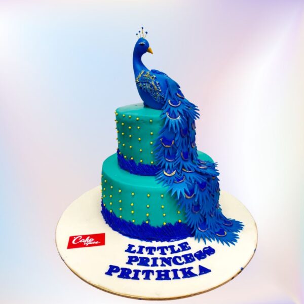 Pretty Peacock 4 Kg 1st Birthday Cake,Stunning 4kg cake shaped like a peacock, featuring vibrant blue and green fondant feathers, gold accents, and a "1" topper for a luxurious first birthday celebration.