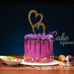 "Purple Sprinkle Beauty 1 Kg Anniversary Cakes. Chocolate dripping cake adorned with purple sprinkles, perfect for anniversaries from Cake Square Chennai."