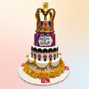 Royal Prince 5 Tier First Birthday Cake - grand multi-tiered cake with gold crown topper and regal blue and gold decorations